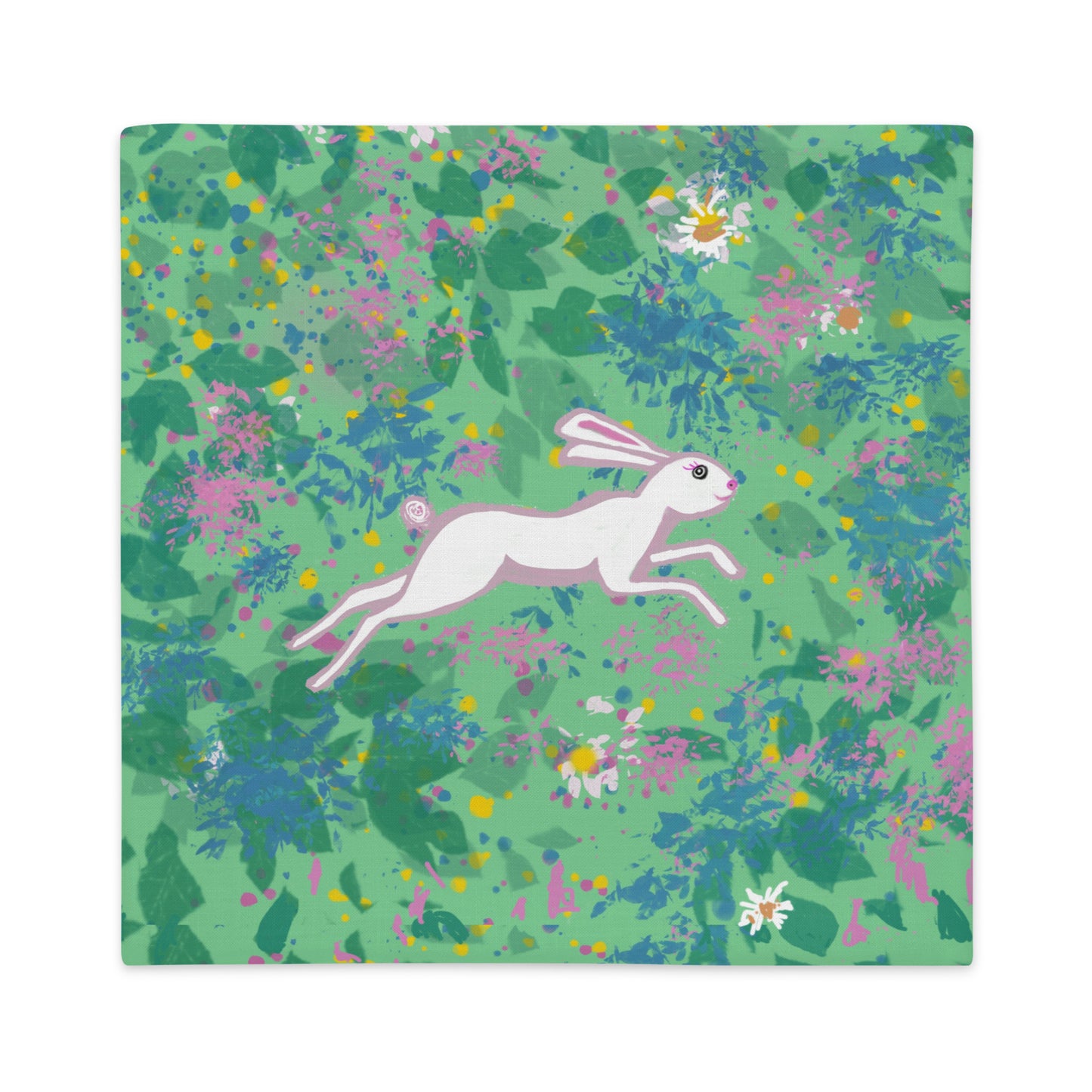 Decorative pillows with a hare running in a field of flowers.