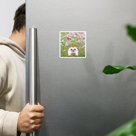 Cute hedgehog on a field of pink and green, with leaves and berries, on a white magnet. 3 sizes. Hedgehog is gentle and kind spirit guide connected to Mother Earth. Shown on a refrigerator being opened.