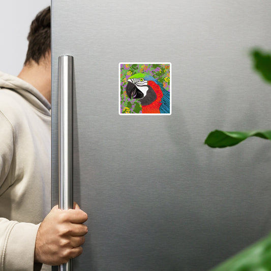 Person opening a refrigerator with a colorful parrot magnet on the door.