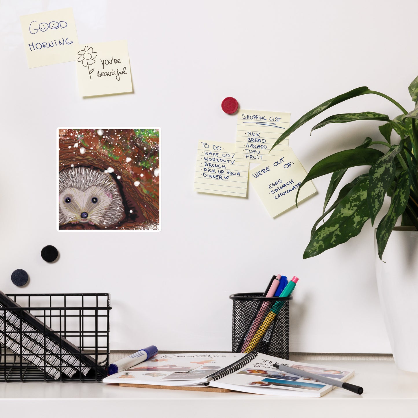 Cute magnet with a garden critter, the hedgehog on a white magnet.  Heddgehog is shown hibernating underground in the snow. Hedgehog, with his sweet face, is gentle and kind spirit animal / spirit guide connected to Mother Earth. 3 sizes.  3x3 inches, 4x4 inches, and 6x6 inches. Shown on a magnetic bulletin board.