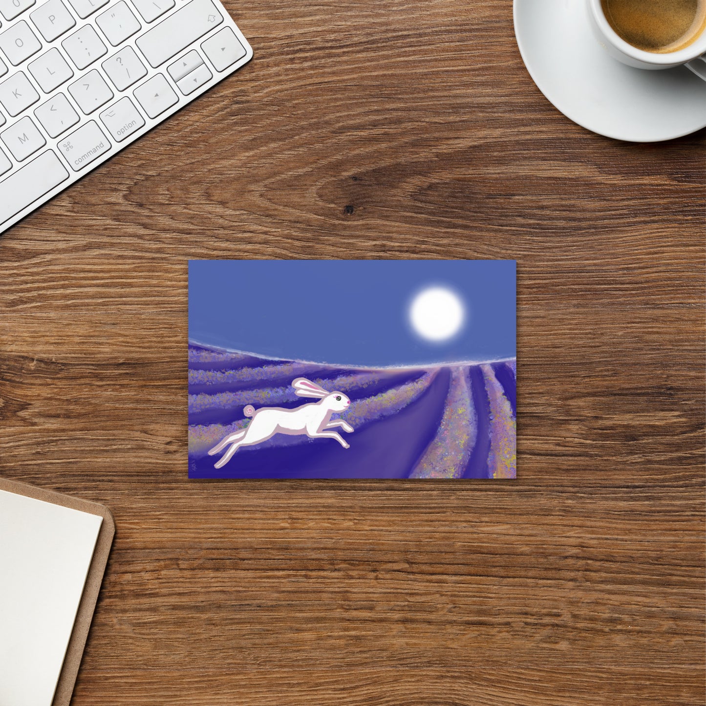 Hare and rabbit are symbols of the trickster--who proves brain over brawn. Seen on this postcard running through a field of flowers under a full moon.