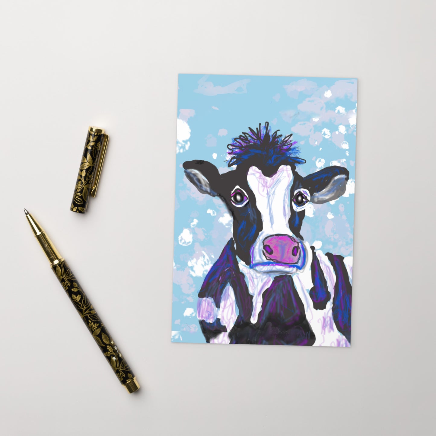 Cow Postcard, shown with a pen and top, animal spirit represents the divine feminine