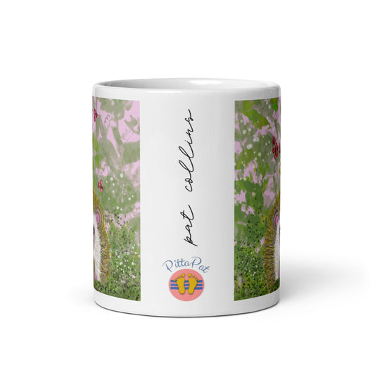 PittaPat spirit animal mug with hedgehog design showing the PittaPat happy toes logo and the artist' signature.