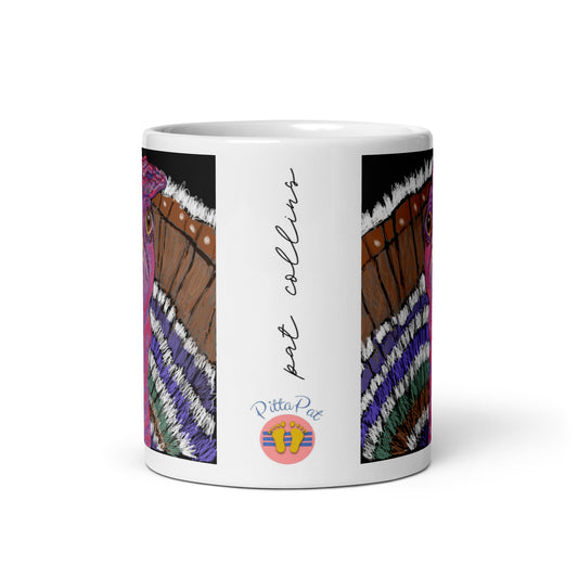 Side view of a ceramic Turkey Spirit Mug showing the PittaPat happy toes logo and the artist's signature.