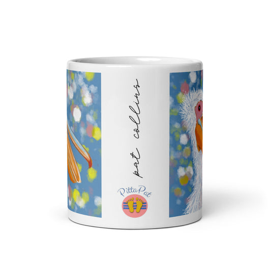 PittaPat happy toes logo with artist's signature on a pelican spirit mug.
