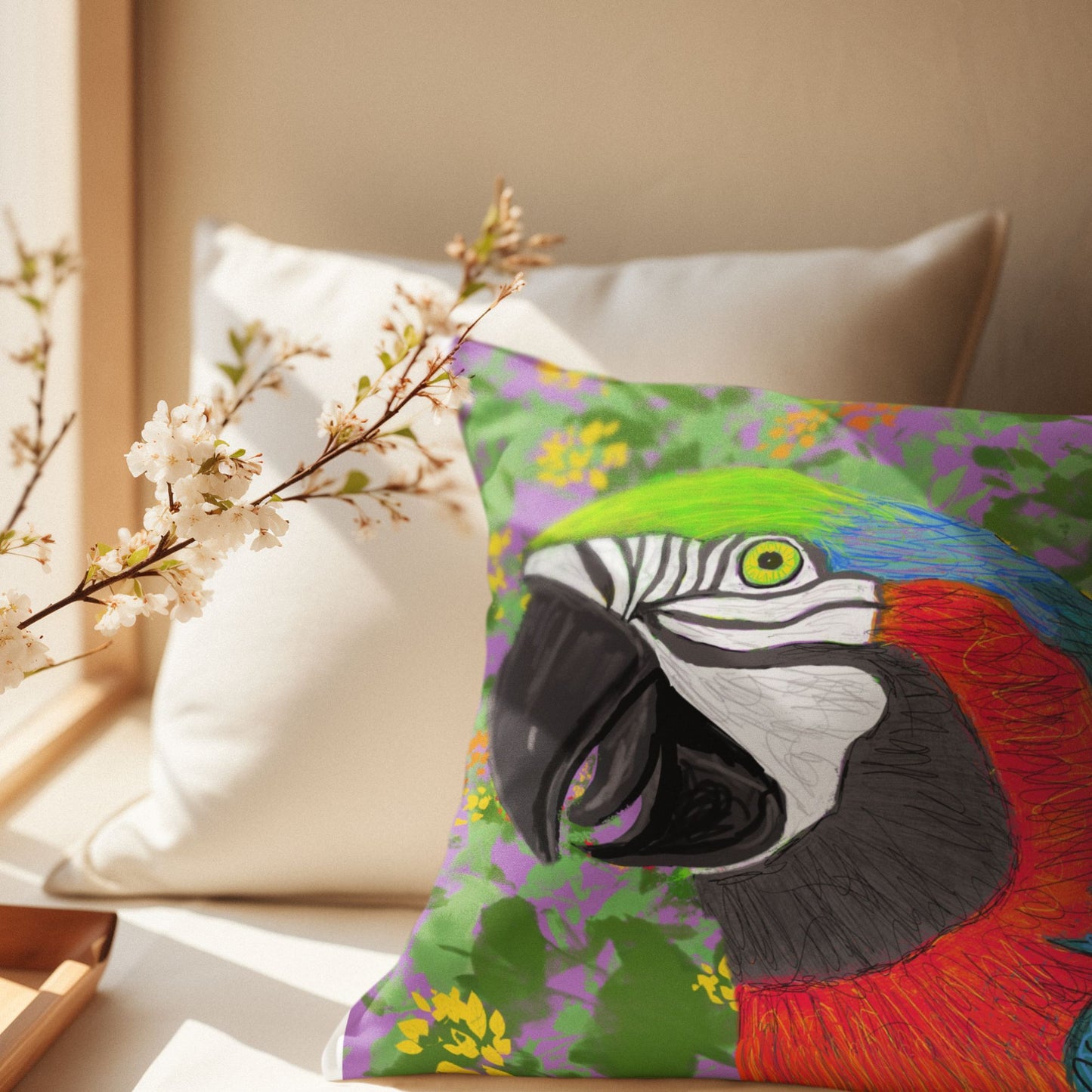Colorful parrot pillow on a couch with a window and a plant in a quiet and zen-like setting. 