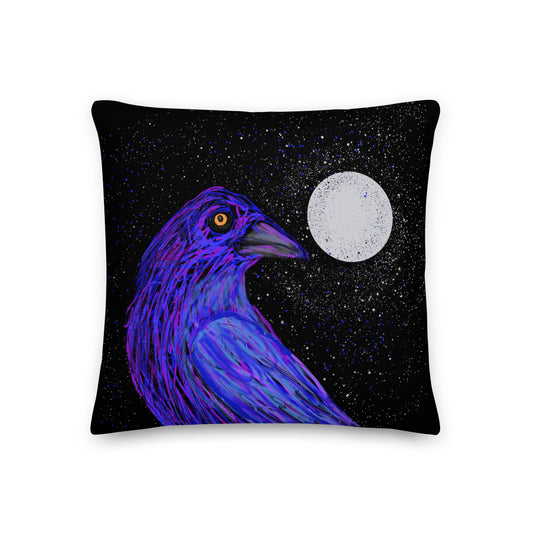 A golden-eyed crow sits next to a full moon on this decorative pillow.