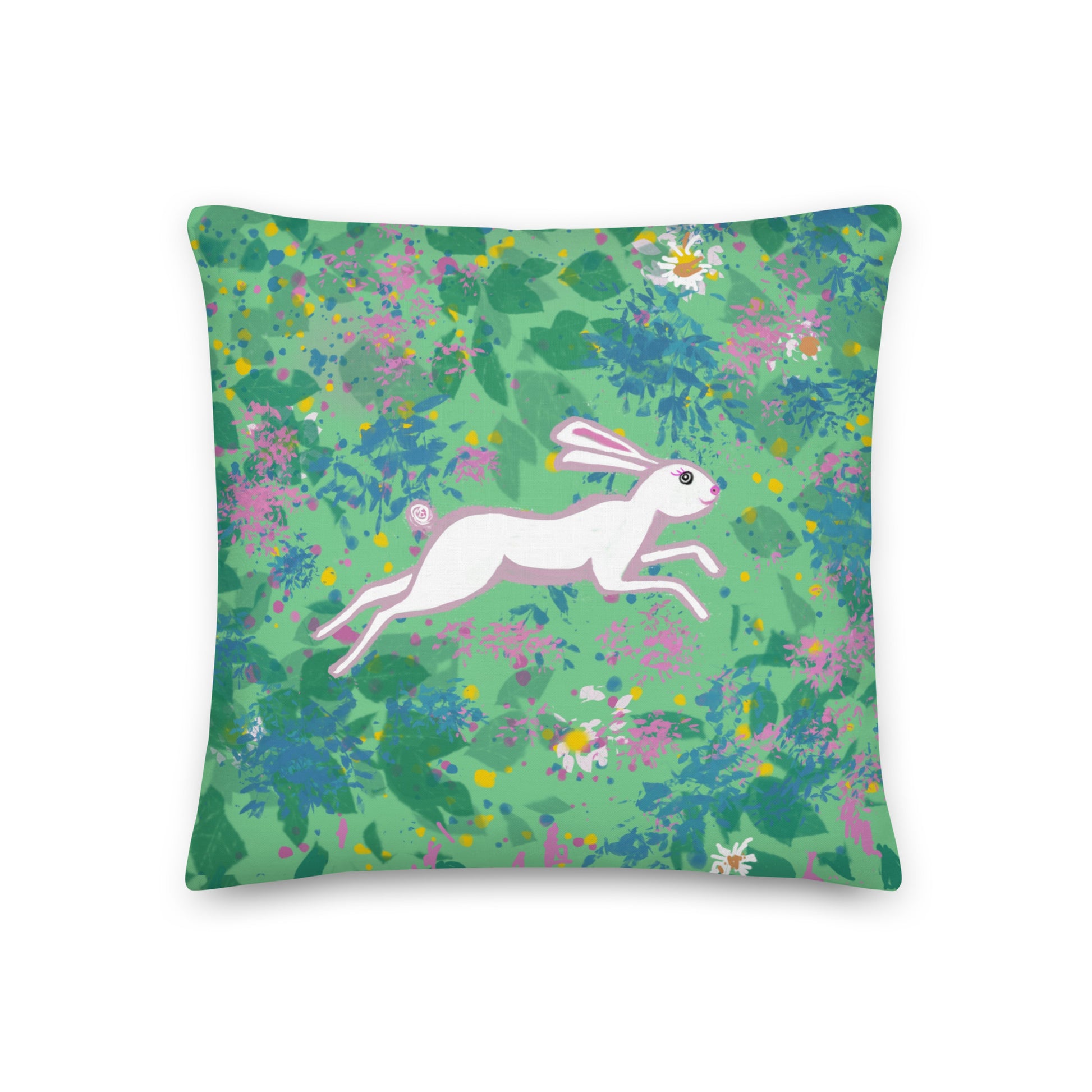 Pillow with an image of a hare running through a field of flowers.