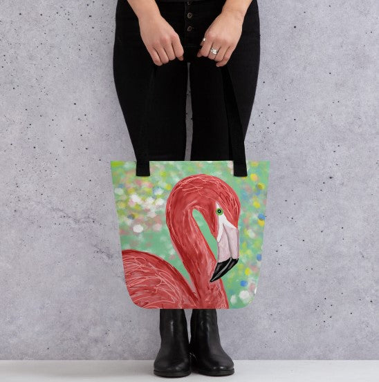 An elegant flamingo against a watery background of pastel colors graces this tote bag. A tote bag to carry everything you need from office to the beach.