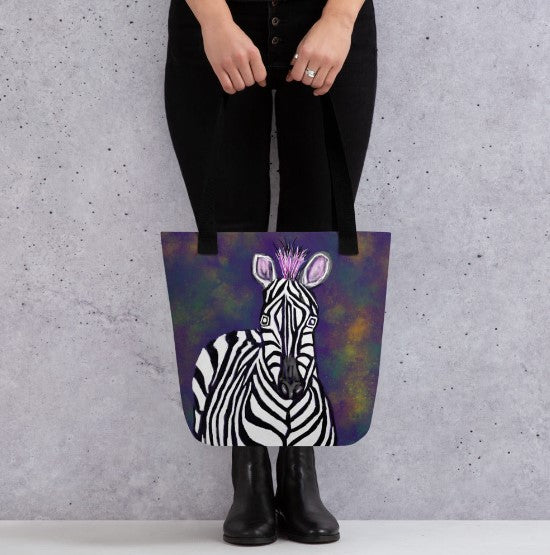 A tote bag to carry everything you need from the office to the beach. Bold design of a zebra against a background of blacks, greens, and golds.