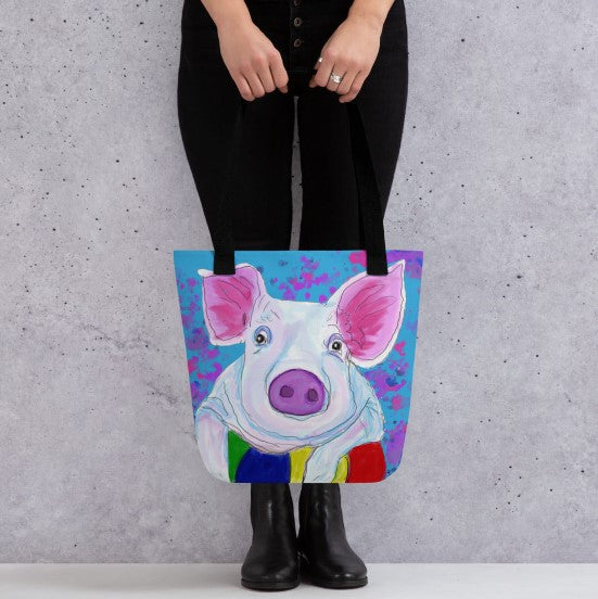 For all the pig lovers, a bright and sturdy tote back with an image of a pig resting on a ball. A tote bag to carry everything you need from the office to the beach.