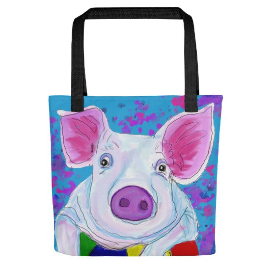 Front view of a bright and cheerful, sturdy tote bag. Image of a pig resting on a ball. Blues and bright pinks.