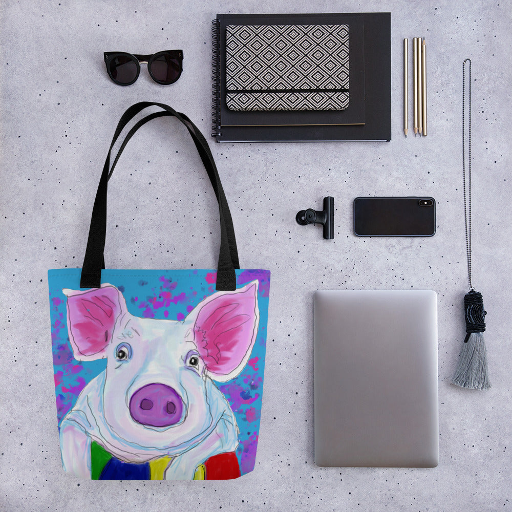 Bright tote bag with an image of a pig resting on a ball. Large enough to hold laptops and notebooks and all the necessities for a trip to the office or the coffee shop.