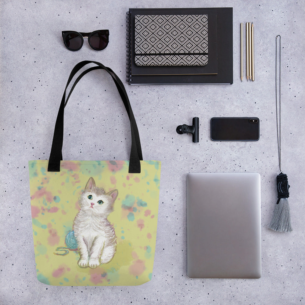 A sweet totebag with a kitten design on a field of yellow and accents of pinks and blues. Large enough to hold laptops and notebooks and all the necessities for a trip to the office or the coffee shop.