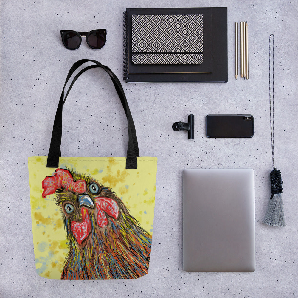 Fun tote bag with a picture of a rooster on a field of yellows and blues. Large enough to hold laptops and notebooks and all the necessities for a trip to the office or the coffee shop.