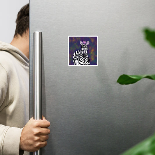 Person opening a refrigerator with a zebra magnet on the door