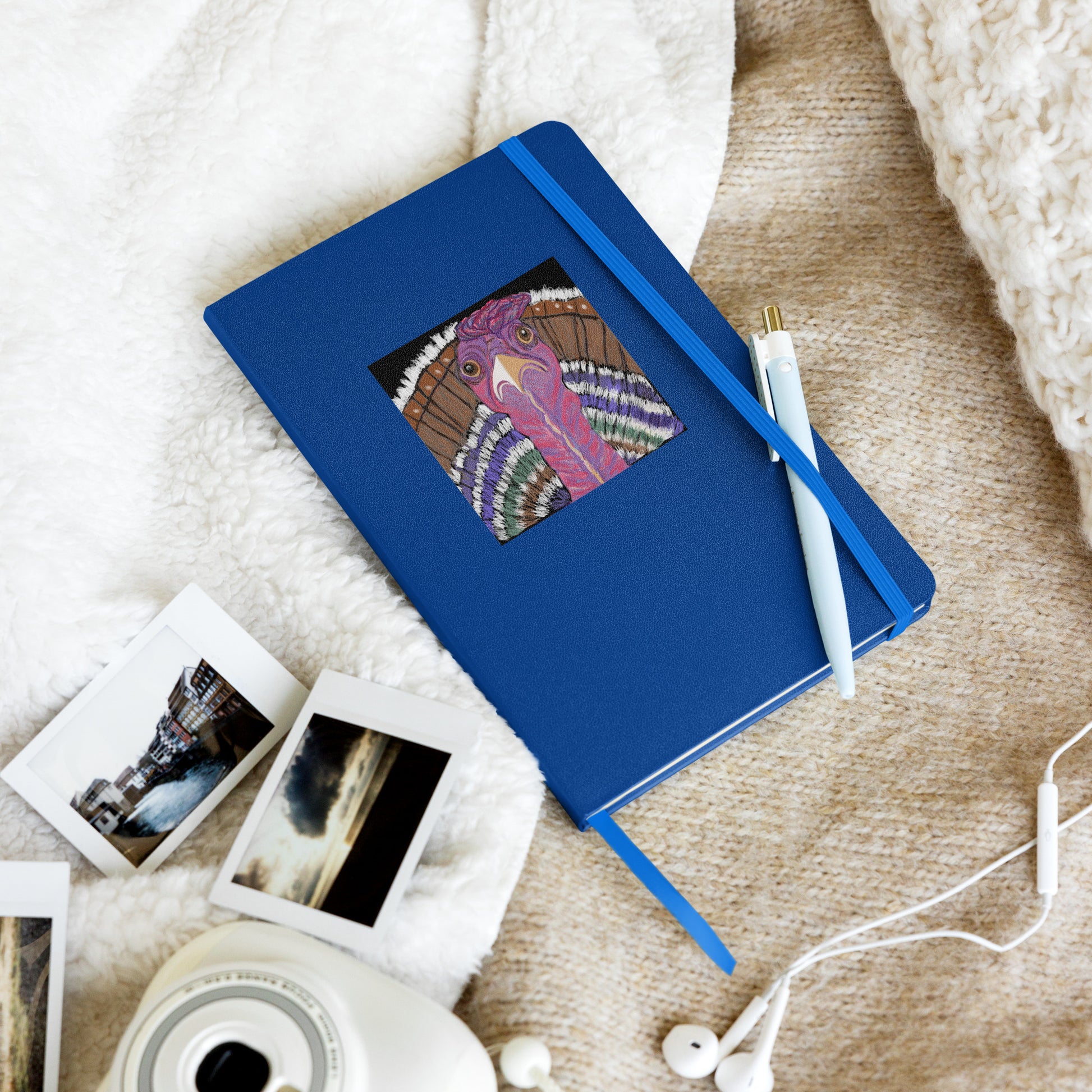 Colorful turkey design on a blue hardcover writing journal with elastic enclosure and ribbon bookmark. 