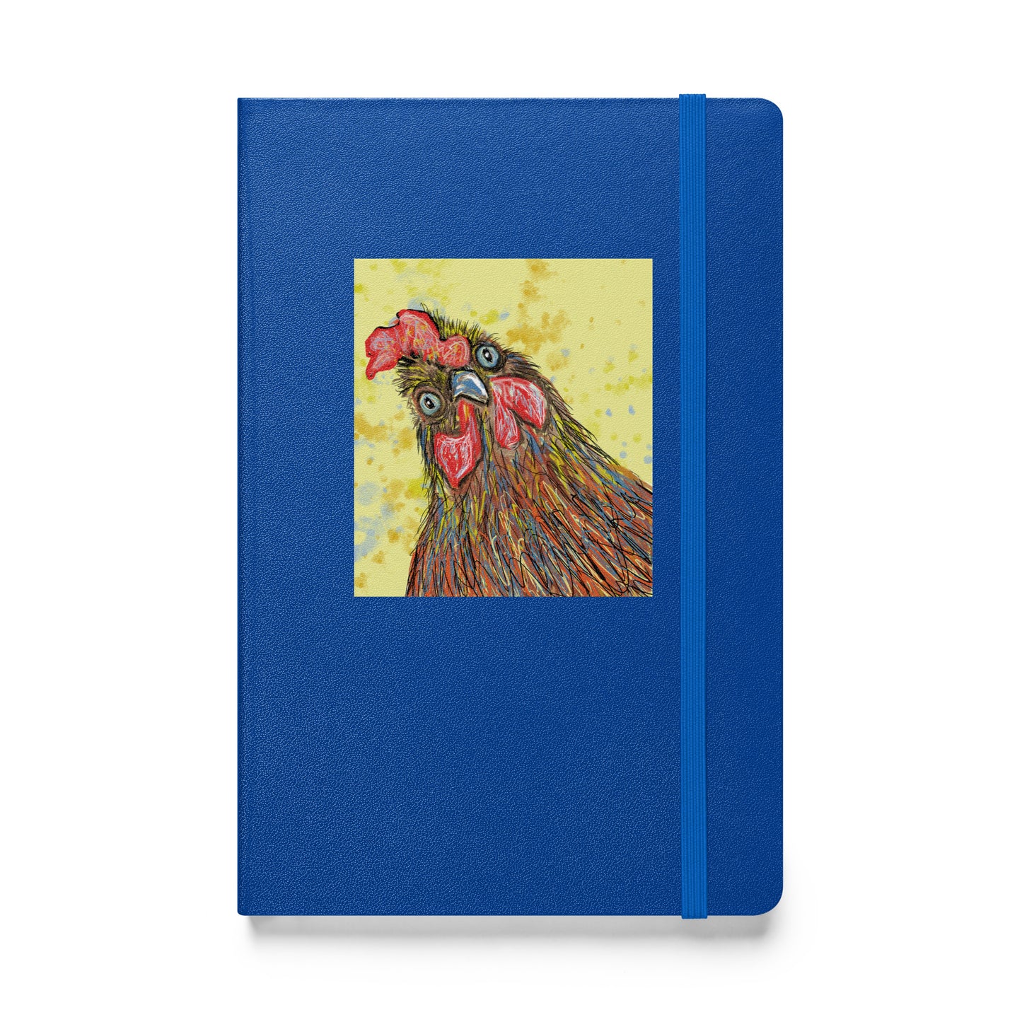 Blue notebook with a rooster illustration on a textured surface, showing an elastic bookmark.