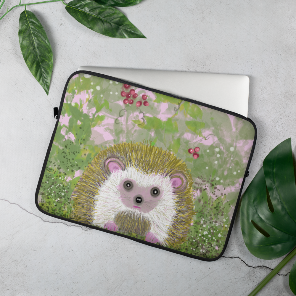 Cute little hedgehog graces the laptop sleeve. Available in 2 sizes, 14 & 13 inches, Hedgehog is shown in a field of green and pink with berries and white butterflies. Share your spirit guide to the kind and gentle Hedgehog.