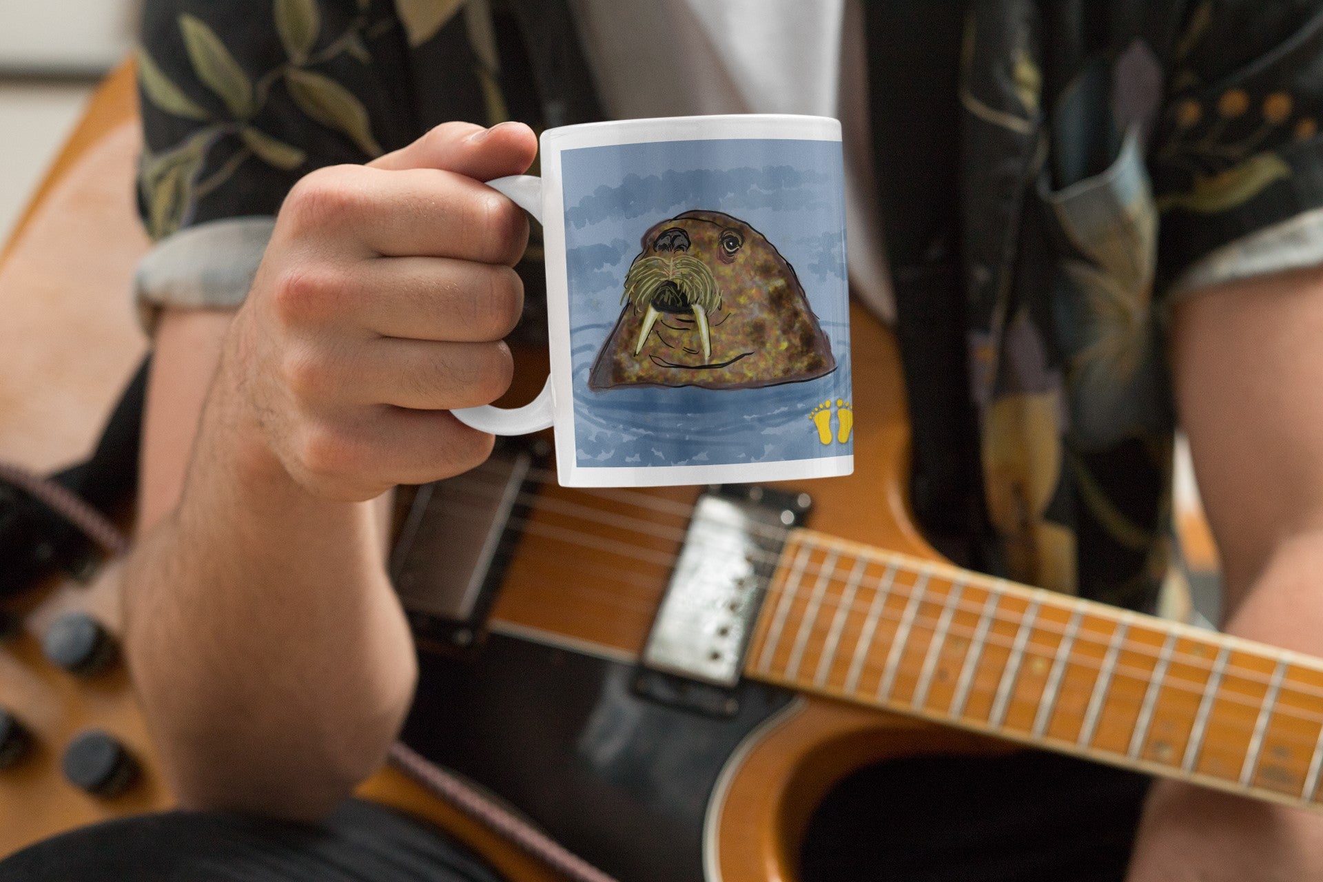 Is this original design of a walrus on a mug by PittaPat your spirit animal? The walrus mug is shown here being held by a musician inspired by the Beatles song, I am the Walrus.