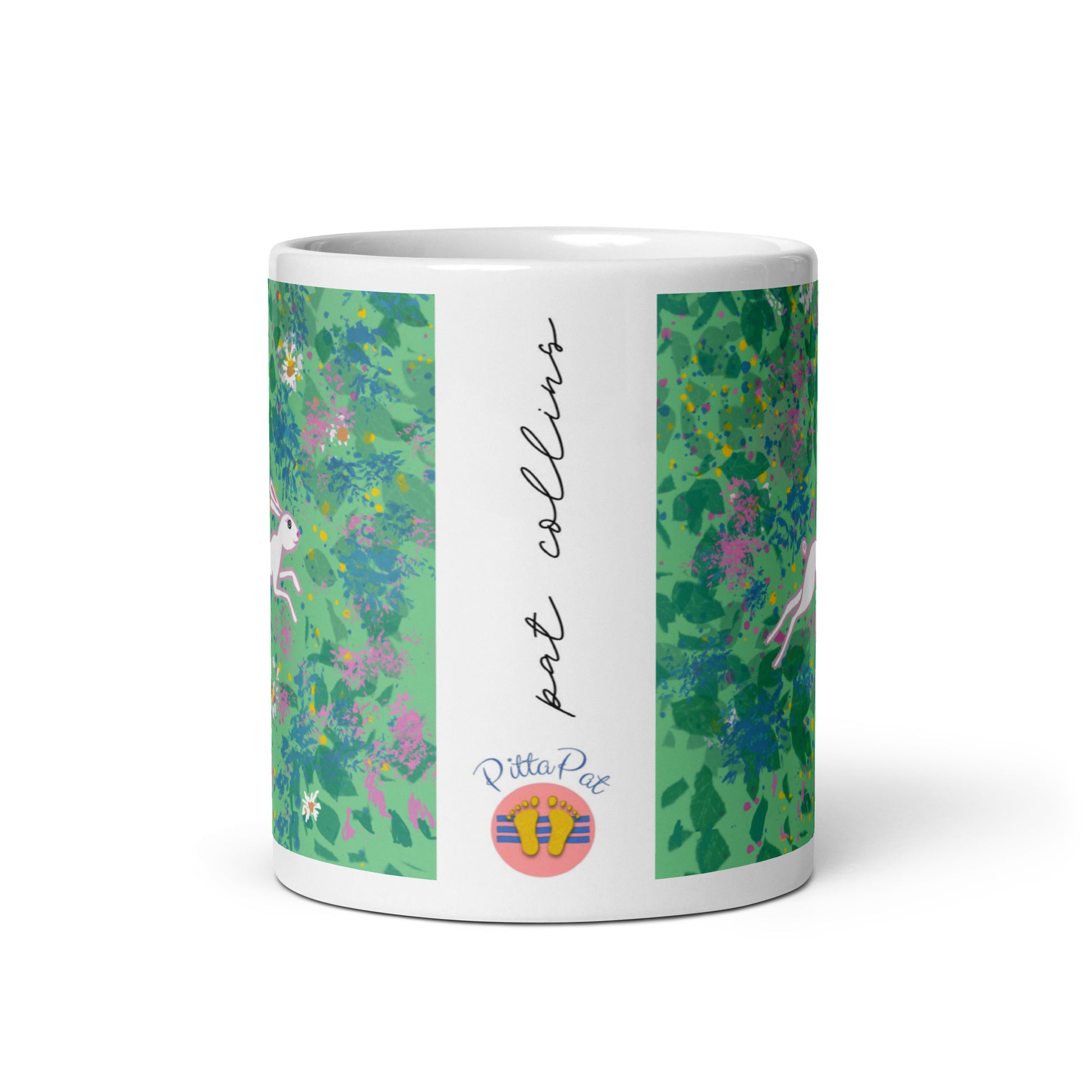PittaPat happy feet logo with artist's signature on side of Spring Hare mug.