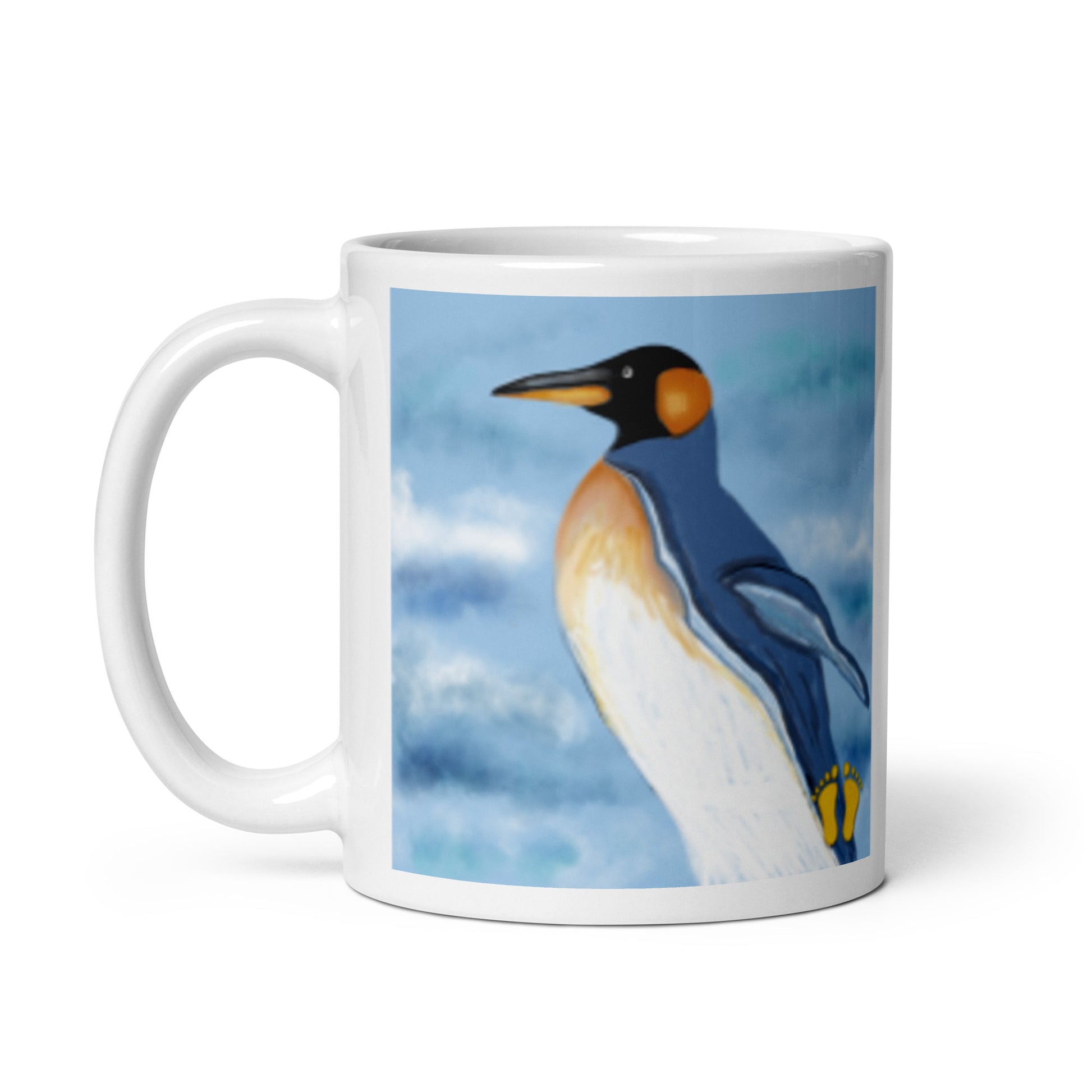 White glossy coffee mug with image of a penguin walking on ice next to the sea. 11 oz mug