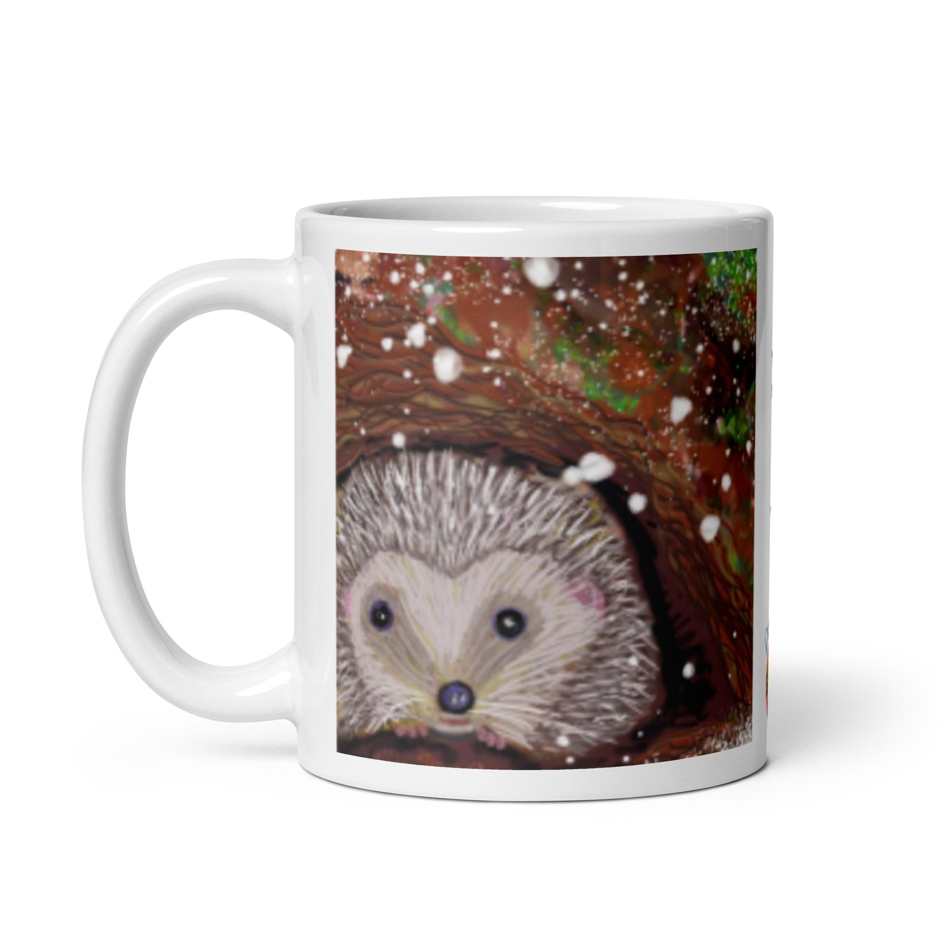 Ceramic mug with hedgehog nestled at the base of a tree in winter, snow falling gently, symbol of rest, protection, and good boundaries. 11 oz.