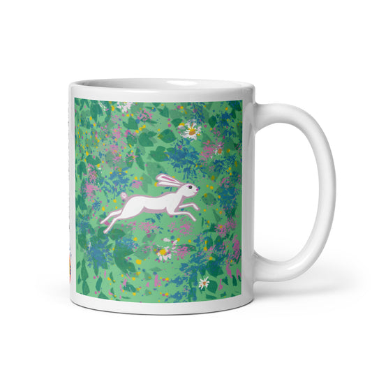 Ceramic spring hare spirit mug with spring hare running through a field of wildflowers, symbol of renewal, agility, and joy.