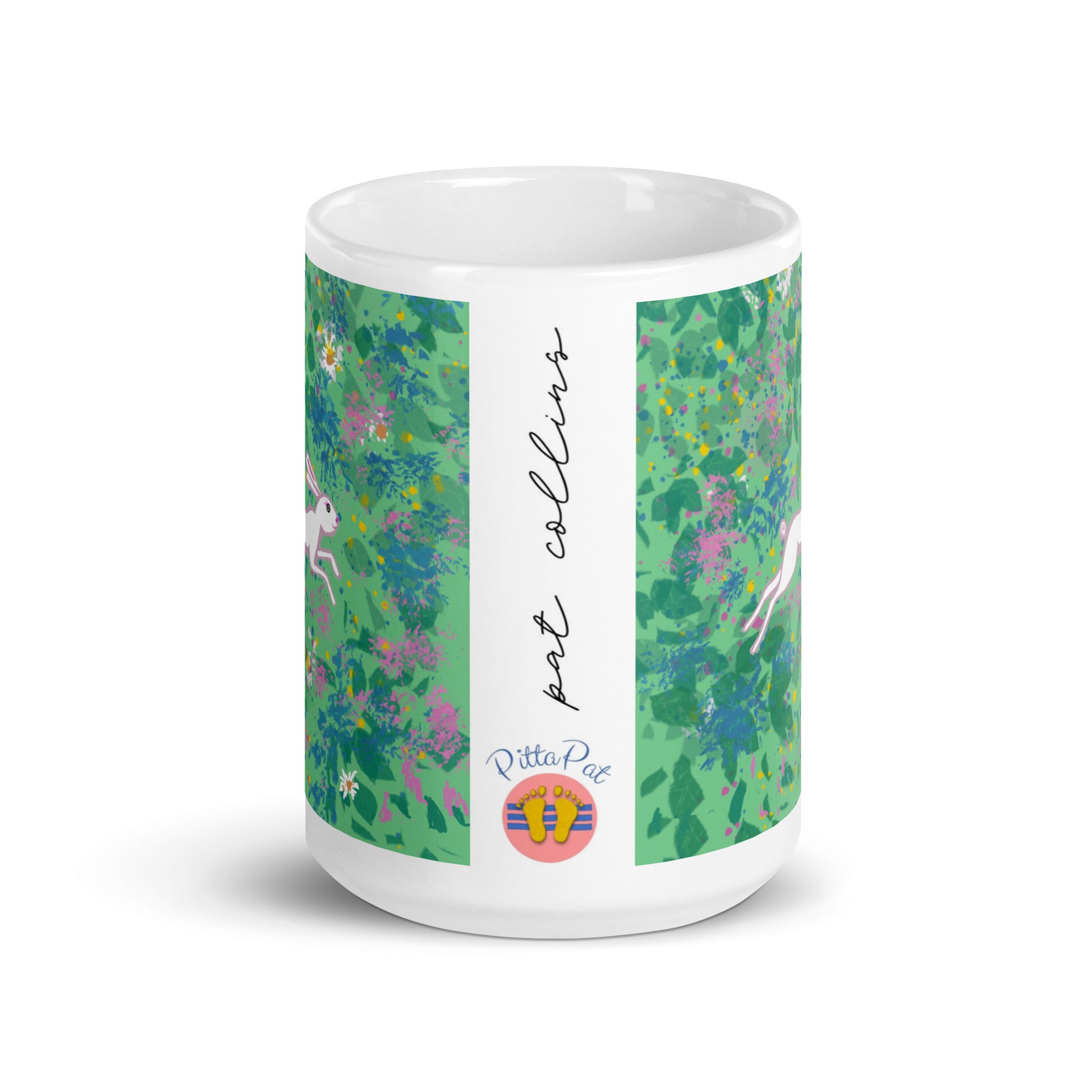 PittaPat happy feet logo with artist's signature on side of Spring Hare mug.