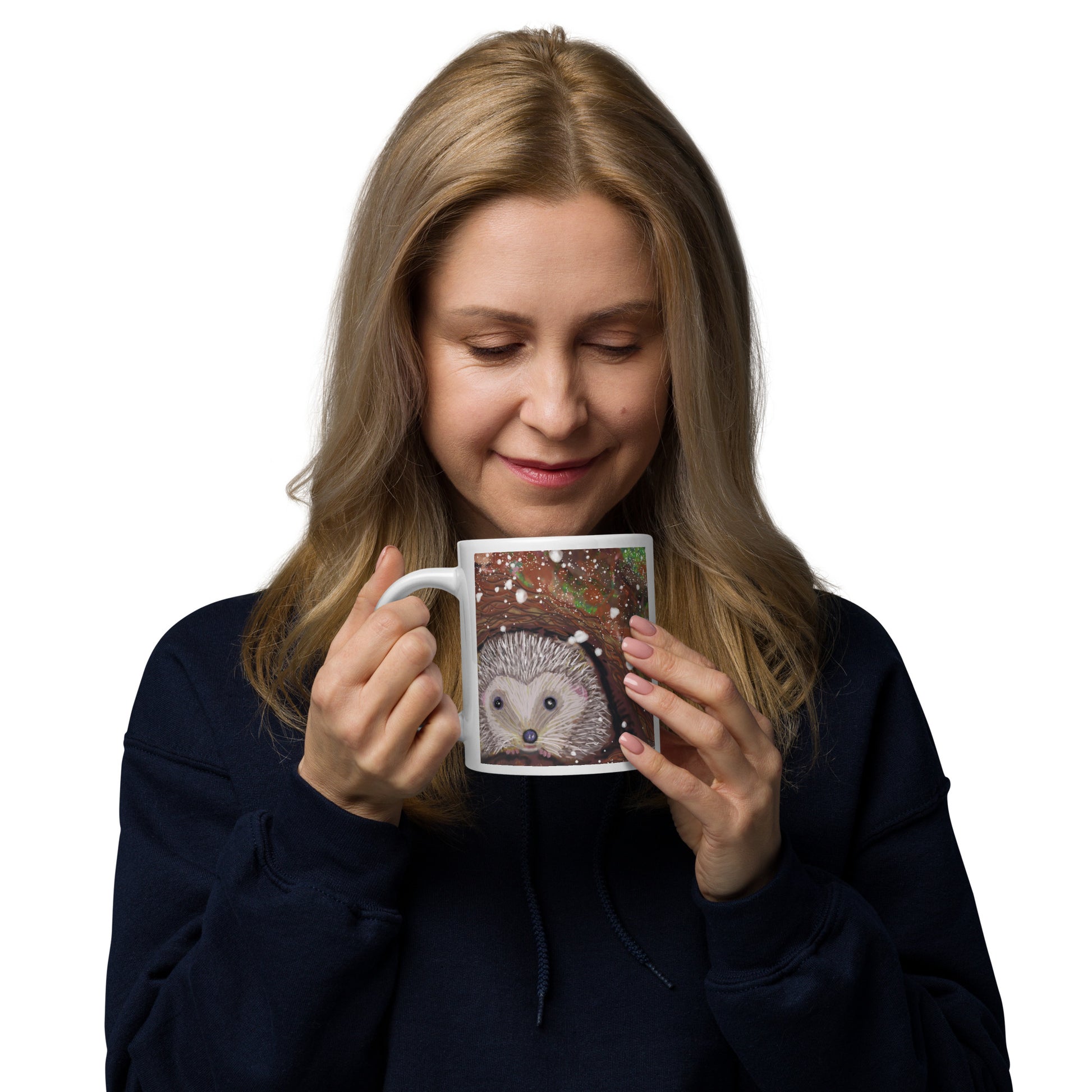 Woman holding a mug with a hedgehog design on a white background