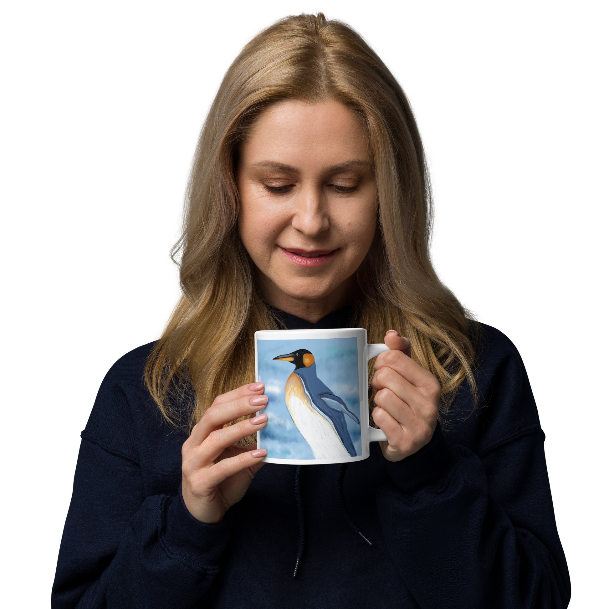 Woman holding a mug with a penguin design on a white background.  20 oz