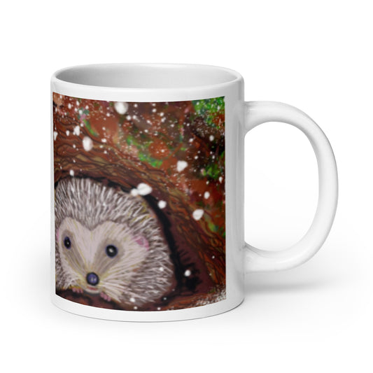 Ceramic mug with hedgehog nestled at the base of a tree in winter, snow falling gently, symbol of rest, protection, and good boundaries. 20 oz