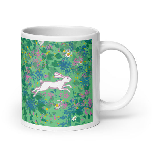Ceramic mug with spring hare running through a field of wildflowers, symbol of renewal, agility, and joy.