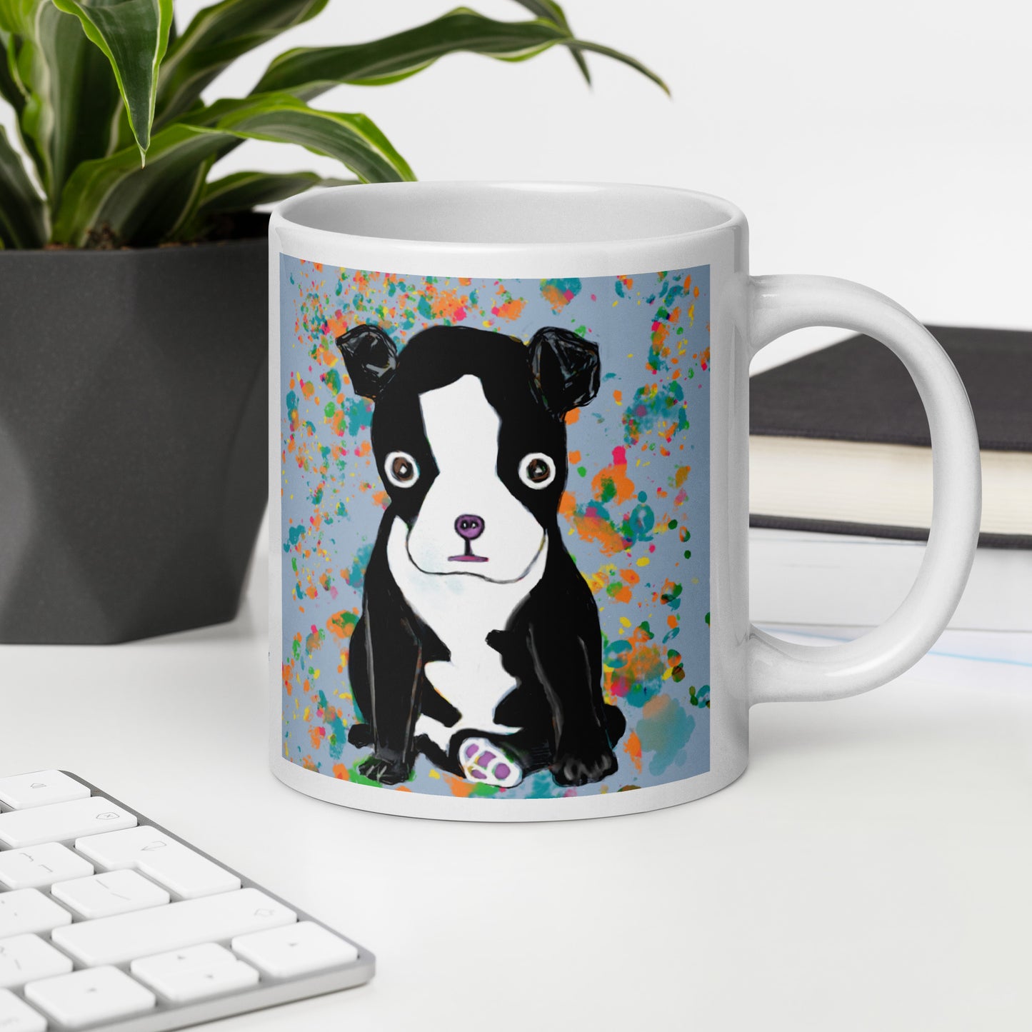 Mug with a Boston Terrier Spirit Mug on a desk with a keyboard and plant.