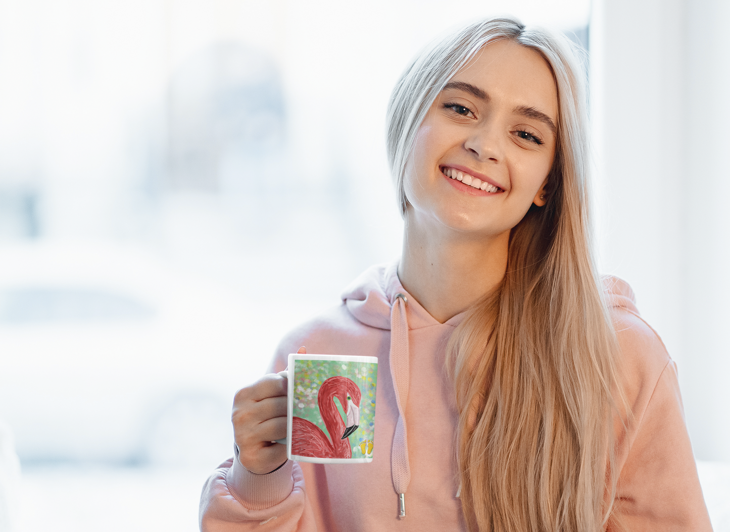 Is this elegant flamingo your spirit animal? The flamngo mug is shown here being held by a woman with long blonde hair holding a flamingo mug.