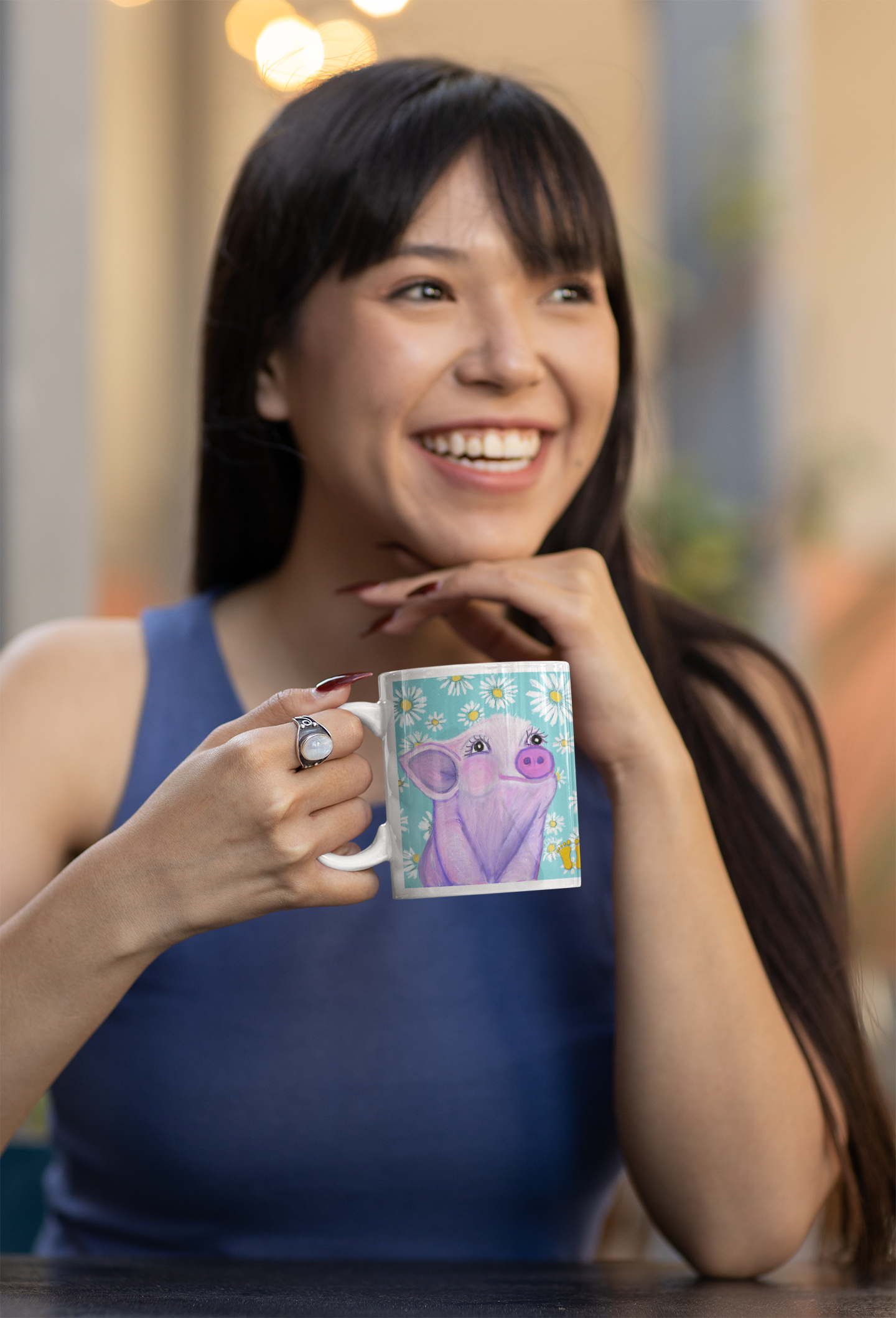 Is the piglet your spirit animal? The piglet mug is shown here being held by a woman enjoying her coffee break. Original design by PittaPat shown with the golden toes.