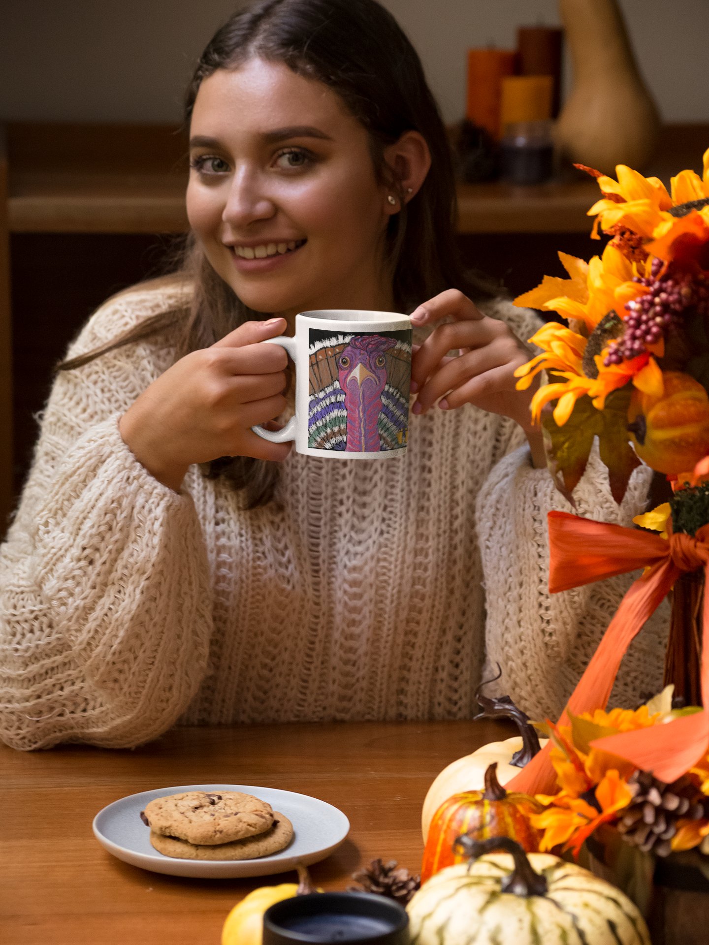 Is this turkey your spirit animal? The courageous and generous turkey is shown here being held by a woman wearing a sweater and sitting at a table decorated for the fall.