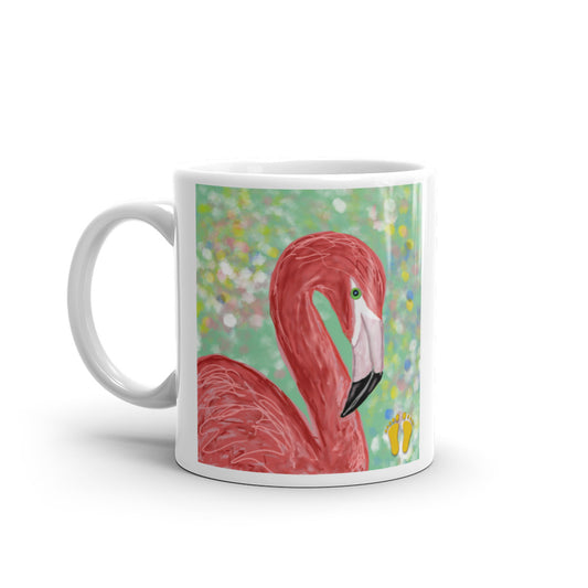 Coffee mug for Flamingo lovers. Elegant design with a flamingo.  Bird on field of green with accents of pink, yellow. blue, and white. Stamped with PittaPat’s golden toes mark. 11 oz mug