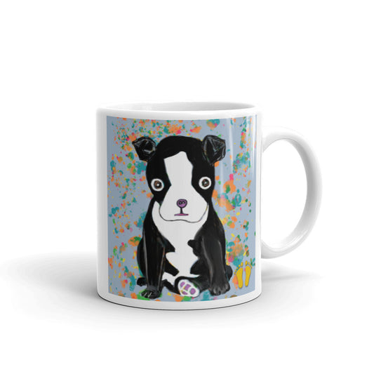 Coffee mug for dog lovers. Unique Boston Terrier design has a sweet expression. Dog on field of blue with orange accents. Stamped with artist's golden toes mark. 11 oz mug